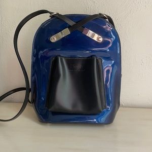 Cute modern backpack! Waterproof material. Cross design.